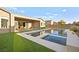 Modern backyard with inviting pool and spa, plus patio furniture at 8535 Black Brush Ln, Las Vegas, NV 89131