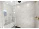 Modern shower with bench seat and frameless glass enclosure at 8535 Black Brush Ln, Las Vegas, NV 89131