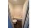 Simple bathroom with a bathtub, toilet, and dark laminate floor at 8553 Last Point Ave, Las Vegas, NV 89129