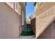 Private backyard with hot tub and gate at 87 Newton Ridge Way, Las Vegas, NV 89183