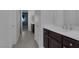 Simple bathroom with single vanity and dark cabinets at 87 Newton Ridge Way, Las Vegas, NV 89183