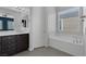 Relaxing bathroom with soaking tub and double sinks at 87 Newton Ridge Way, Las Vegas, NV 89183