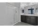 Modern bathroom with walk-in shower and double vanity at 87 Newton Ridge Way, Las Vegas, NV 89183