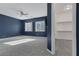 Spacious bedroom with a navy blue accent wall at 87 Newton Ridge Way, Las Vegas, NV 89183