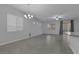 Bright dining room with tile floors and chandelier at 87 Newton Ridge Way, Las Vegas, NV 89183