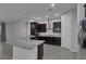 Modern kitchen with dark cabinets, granite counters and stainless steel appliances at 87 Newton Ridge Way, Las Vegas, NV 89183