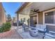 Relaxing covered patio with fire pit and seating at 87 Newton Ridge Way, Las Vegas, NV 89183