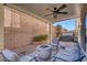 Relaxing covered patio with fire pit and seating at 87 Newton Ridge Way, Las Vegas, NV 89183