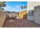 Landscaped backyard with fire pit and seating area at 8753 Arawana Pl, Henderson, NV 89074