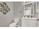 Updated bathroom with white vanity and fixtures at 8753 Arawana Pl, Henderson, NV 89074