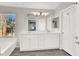 Bathroom with double vanity, soaking tub, and walk-in shower at 8753 Arawana Pl, Henderson, NV 89074