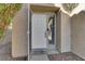 White front door with a welcome mat, and stone pathway at 8753 Arawana Pl, Henderson, NV 89074