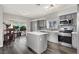 Modern kitchen with stainless steel appliances and island at 8753 Arawana Pl, Henderson, NV 89074