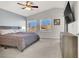 Spacious main bedroom with a king-size bed and dresser at 8753 Arawana Pl, Henderson, NV 89074