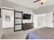 Main bedroom with a barn door leading to the en-suite bathroom at 8753 Arawana Pl, Henderson, NV 89074