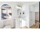 Modern bathroom with white cabinets and gold fixtures at 9 White Tail Ct, Henderson, NV 89074