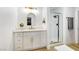 Modern bathroom with white vanity and gold accents at 9 White Tail Ct, Henderson, NV 89074