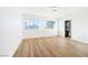 Bright bedroom featuring light wood flooring and large windows at 9 White Tail Ct, Henderson, NV 89074