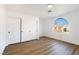 Bright bedroom with large window and white sliding doors at 9 White Tail Ct, Henderson, NV 89074