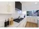 Modern kitchen with white cabinets and gold accents at 9 White Tail Ct, Henderson, NV 89074