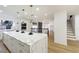 Modern kitchen with white cabinets, marble countertops, and gold accents at 9 White Tail Ct, Henderson, NV 89074