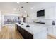 Modern kitchen with marble countertops and a large island at 9 White Tail Ct, Henderson, NV 89074