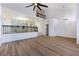 Open living room with view of the kitchen and upper level at 9 White Tail Ct, Henderson, NV 89074