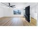 Main bedroom with walk-in closet, ceiling fan and wood-look floors at 9 White Tail Ct, Henderson, NV 89074