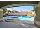 Relaxing pool and spa viewed from covered patio at 9 White Tail Ct, Henderson, NV 89074