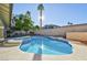 Relaxing kidney-shaped pool with a spa and sun deck at 9 White Tail Ct, Henderson, NV 89074