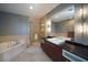 Upscale bathroom with soaking tub, shower, and modern vanity at 900 Las Vegas Blvd # 901, Las Vegas, NV 89101