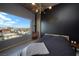 Modern bedroom with city views and a dark accent wall at 900 Las Vegas Blvd # 901, Las Vegas, NV 89101