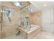 Spa-like bathroom with a glass-enclosed shower and soaking tub at 9103 Alta Dr # 501, Las Vegas, NV 89145