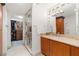 Large bathroom with double vanity, walk-in shower, and access to closet at 9103 Alta Dr # 501, Las Vegas, NV 89145