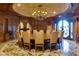 Elegant formal dining room with a large table and chandelier at 9103 Alta Dr # 501, Las Vegas, NV 89145