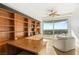 Bright home office features built-in bookshelves and city views at 9103 Alta Dr # 501, Las Vegas, NV 89145