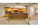 Gourmet kitchen boasts expansive island and rich wood cabinetry at 9103 Alta Dr # 501, Las Vegas, NV 89145