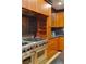 Stainless steel appliances and custom wood cabinetry in kitchen at 9103 Alta Dr # 501, Las Vegas, NV 89145