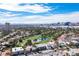 Aerial view of house on golf course with city skyline in background at 915 Vegas Valley Dr # 4, Las Vegas, NV 89109