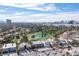 Aerial view of house on golf course with city skyline in background at 915 Vegas Valley Dr # 4, Las Vegas, NV 89109