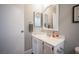 Clean bathroom with vanity, mirror and quartz countertop at 915 Vegas Valley Dr # 4, Las Vegas, NV 89109