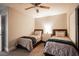 Bedroom with twin beds, ceiling fan and brick feature wall at 915 Vegas Valley Dr # 4, Las Vegas, NV 89109