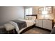 Bedroom with queen bed, bench, and neutral decor at 915 Vegas Valley Dr # 4, Las Vegas, NV 89109