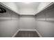 Large walk-in closet with double hanging rods and carpeted floor at 915 Vegas Valley Dr # 4, Las Vegas, NV 89109