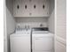 Laundry area with washer, dryer, and overhead cabinets at 915 Vegas Valley Dr # 4, Las Vegas, NV 89109