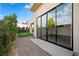 Covered patio and sliding glass doors leading to backyard at 9780 Solar Ave, Las Vegas, NV 89149