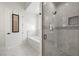 Modern bathroom with soaking tub and glass shower at 9780 Solar Ave, Las Vegas, NV 89149