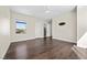 Bedroom with hardwood floors, window, and door to the bathroom at 9780 Solar Ave, Las Vegas, NV 89149