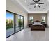 Bright bedroom with sliding glass doors leading to the backyard at 9780 Solar Ave, Las Vegas, NV 89149