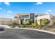 Luxury modern home with expansive windows and landscaped front yard at 9780 Solar Ave, Las Vegas, NV 89149